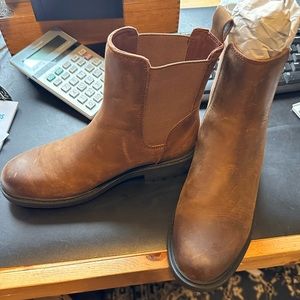 Size 7.5 Brown Faux leather boots. Never worn